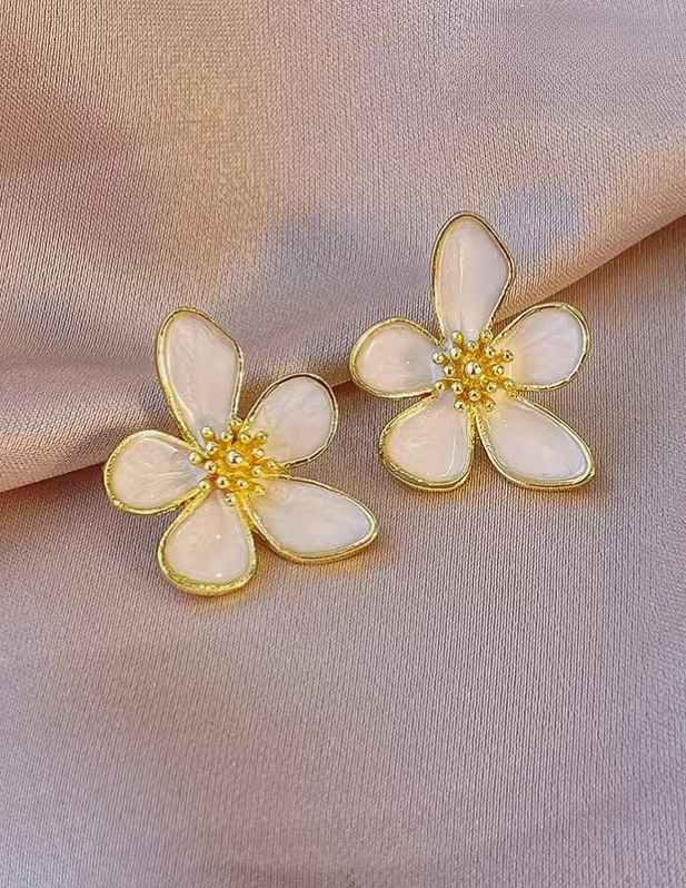 White Floral Earrings shop now